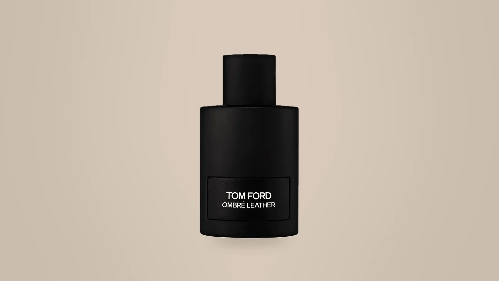 Our photo of a black Tom Ford Ombré Leather bottle on a warm taupe backdrop