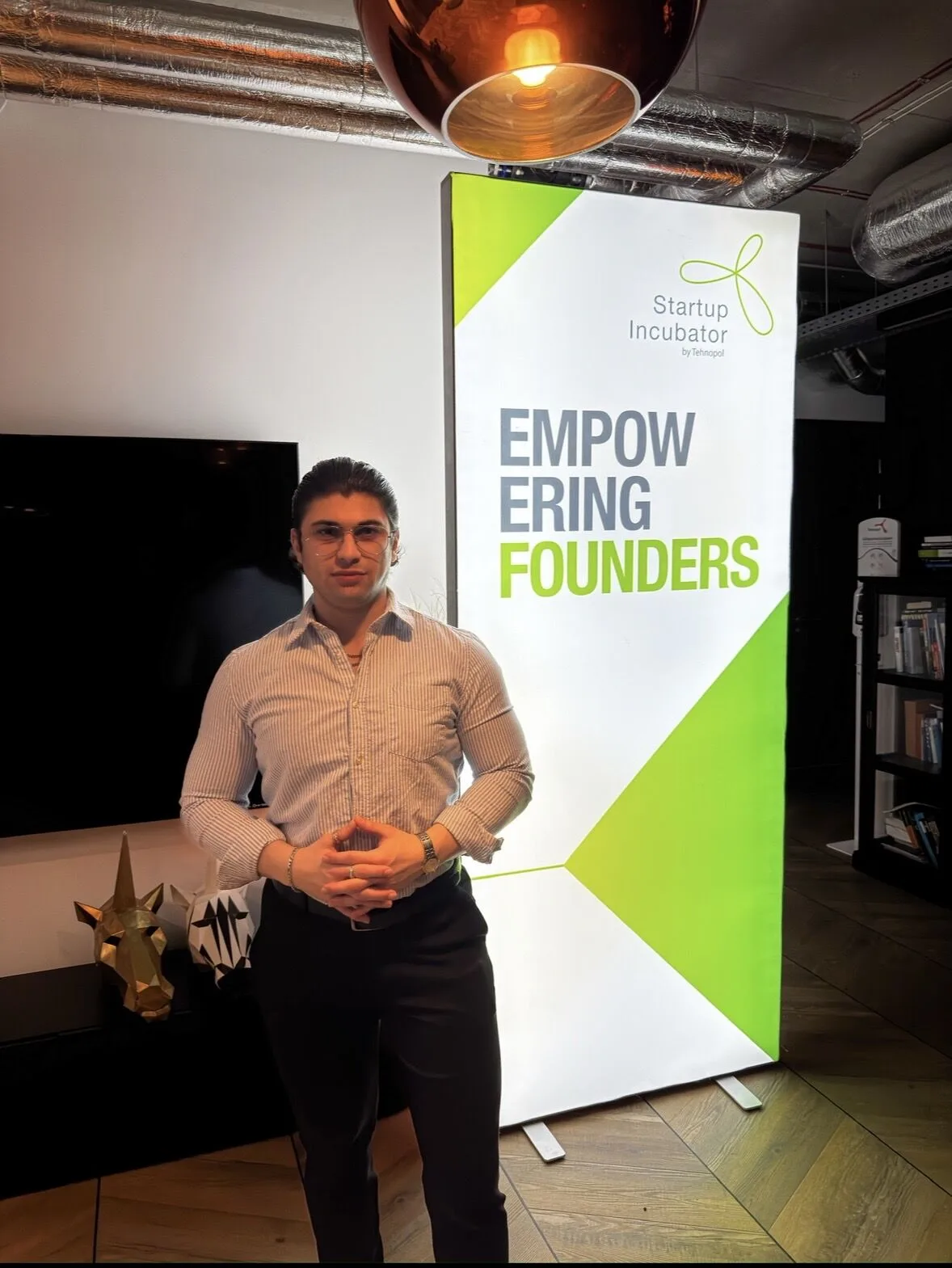 Ömer Kadir Kurt representing Fragnatique at the Tehnopol Startup Incubator Empowering Founders banner