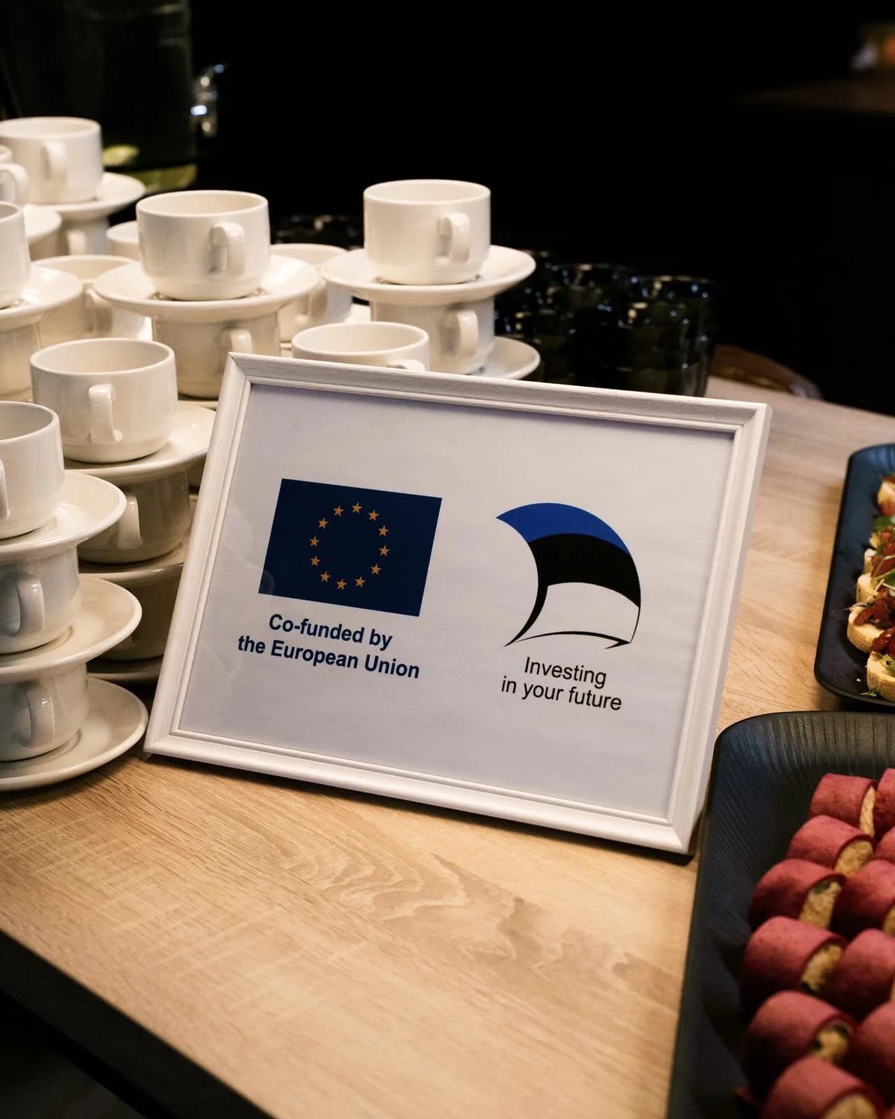 A Co-funded by the European Union sign at a Tehnopol Startup Incubator gathering in Tallinn