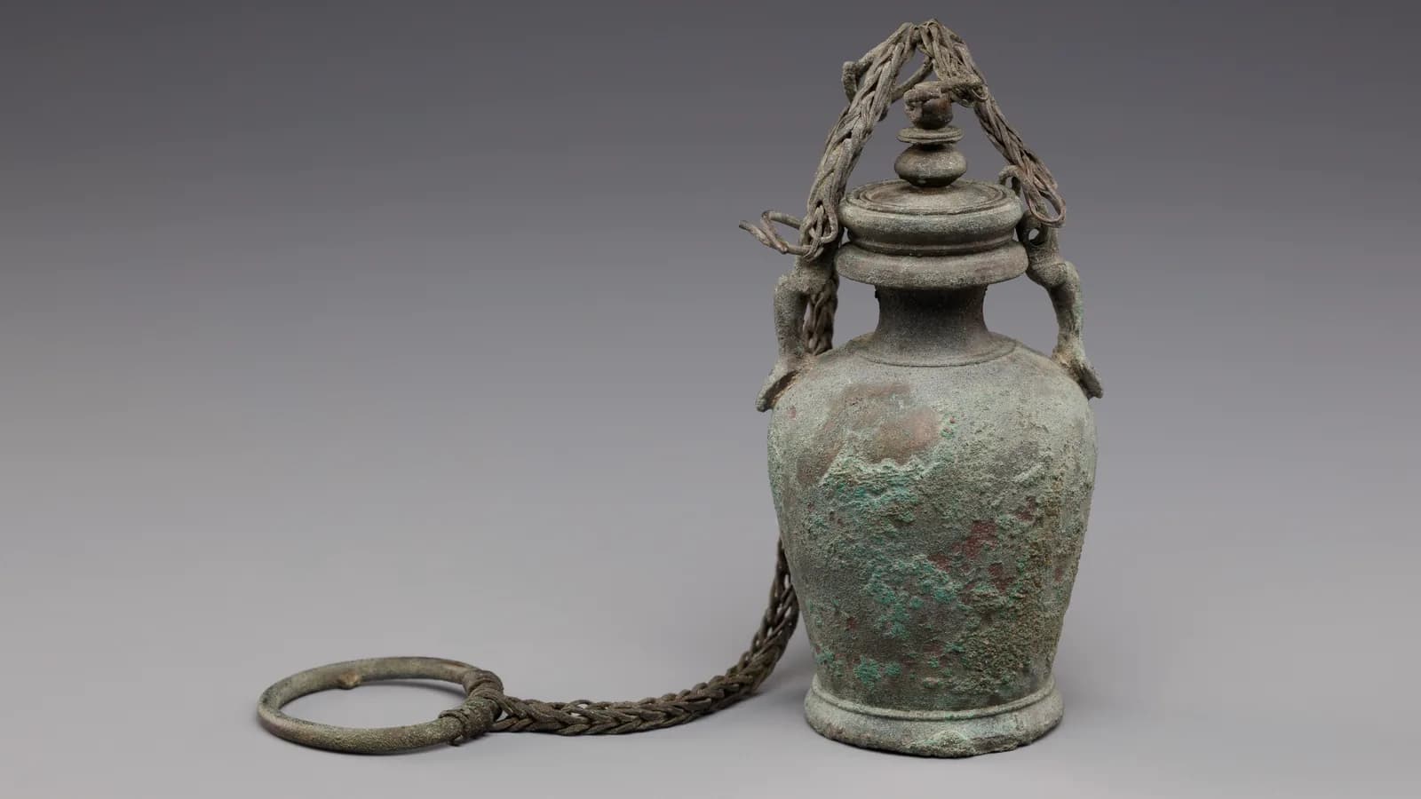 An ancient bronze vessel with a chain handle from The Met collection